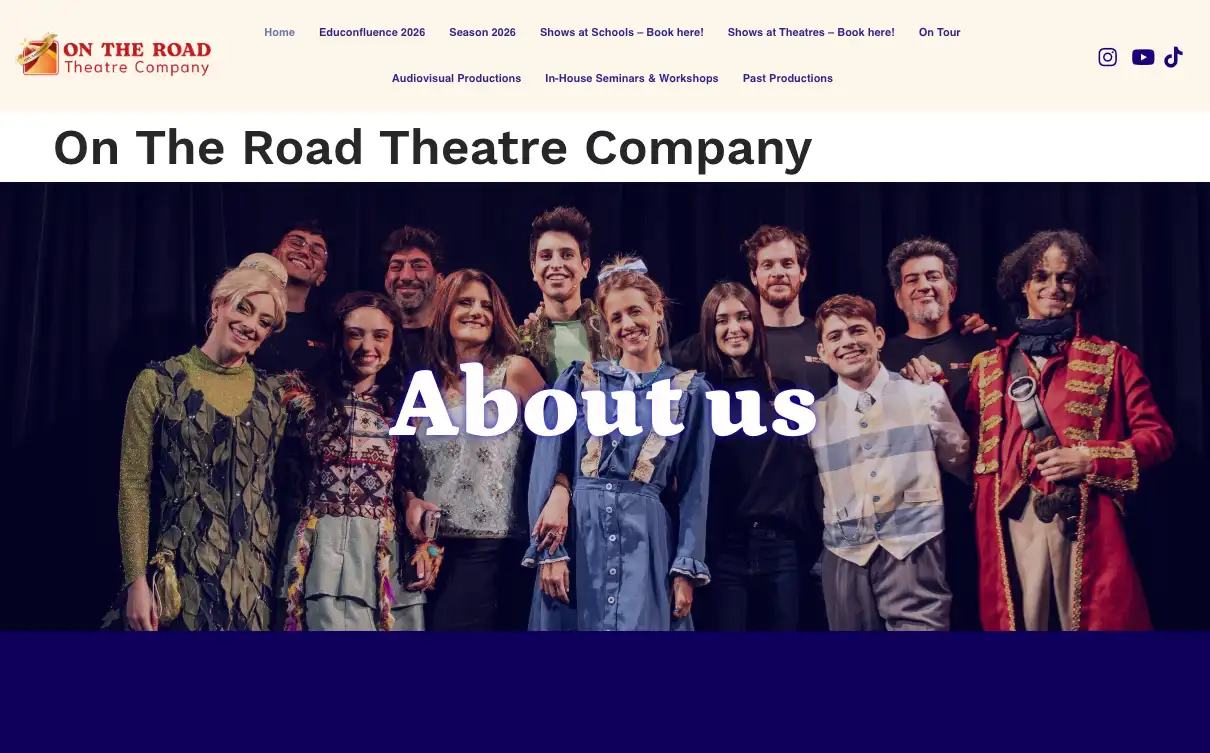 The On The Road Theatre Company website, with the cast in costume on stage under an About us heading